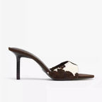 Tacones mule de piel de vaca Rhea