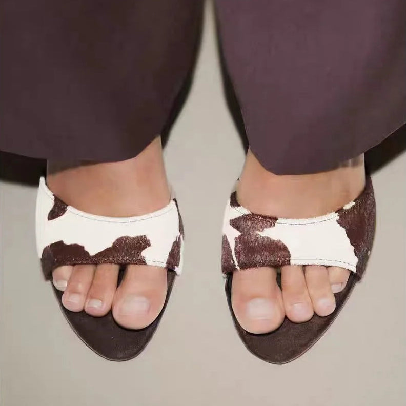 Tacones mule de piel de vaca Rhea